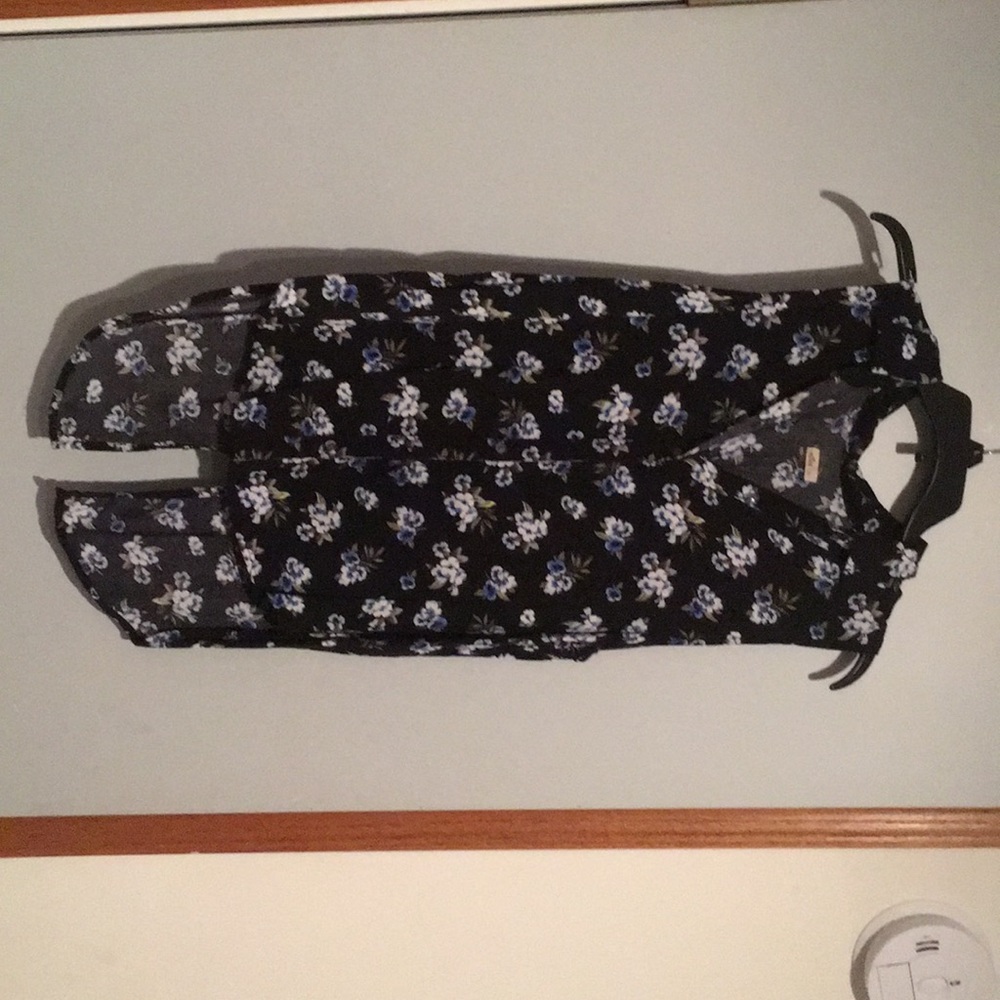 A hollister floral button up top with an open back